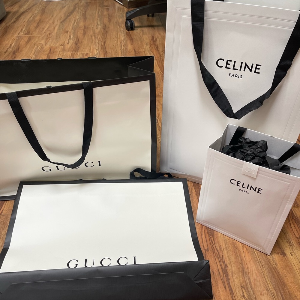 4 gucci and celine shopping bags from the store